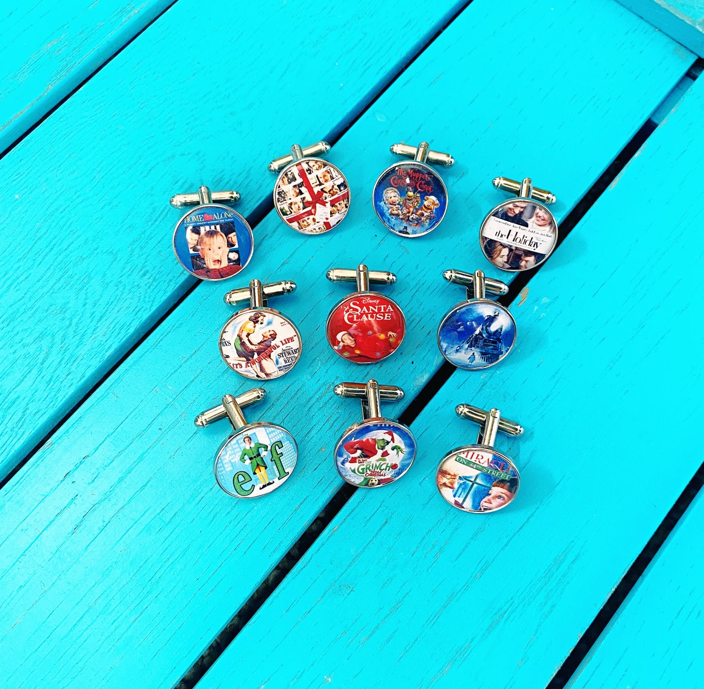 Christmas Movie Poster Cufflinks. Tie Clips. Pocket Watch. Holiday Film. Elf. Santa Clause. Grinch. Home Alone. It's a Wonderful Life.