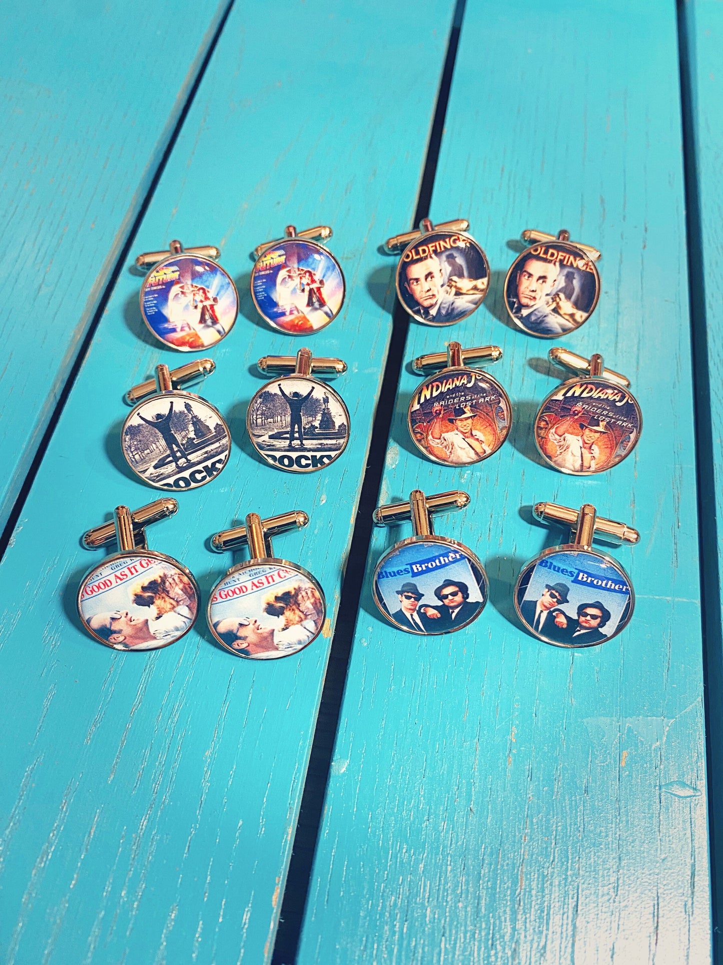 Christmas Movie Poster Cufflinks. Tie Clips. Pocket Watch. Holiday Film. Elf. Santa Clause. Grinch. Home Alone. It's a Wonderful Life.